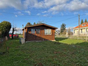 Chalet en bois charmant sur un terrain arbor�
